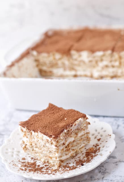 This no-bake Nescafe cake is a coffee-favored cold cake that will satisfy your cravings . Its soft creaminess and delicious layers are perfect for the summer heat !