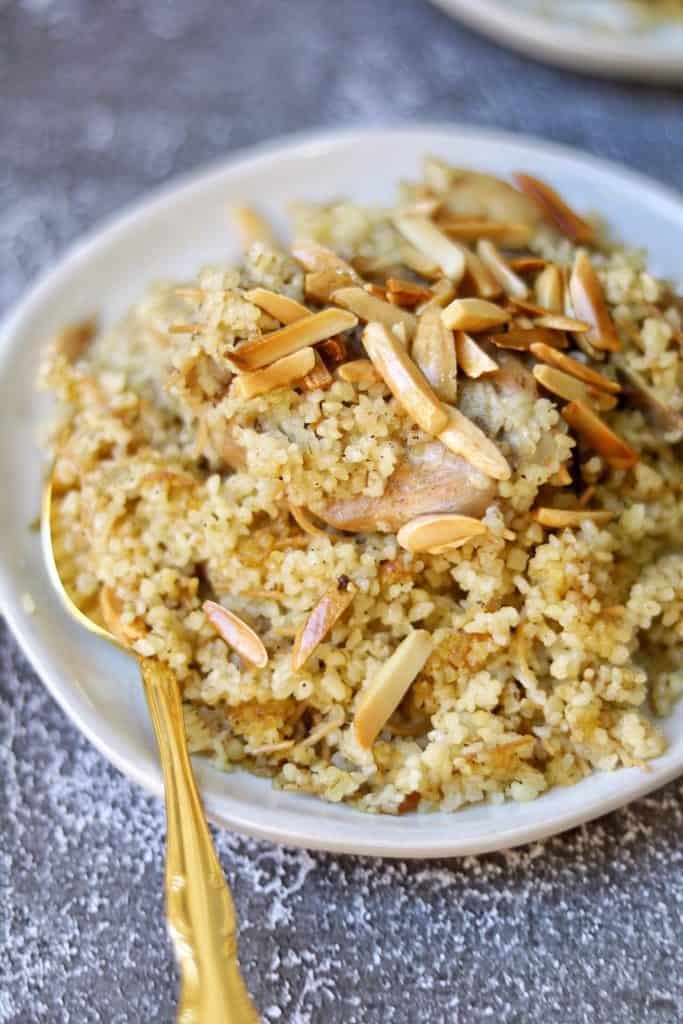A special healthy Bulgar pilaf with vermicelli and chicken topped with toasted almonds. It is a traditional dish in Kurdistan.