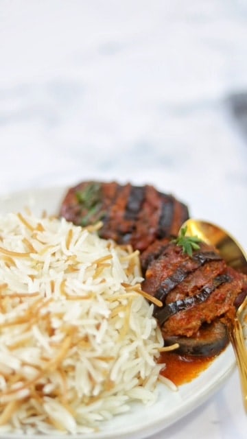 This eggplant kabob is both steamy and delicious . It's the perfect meal of stuffed vegetables and a side of rice pilaf!