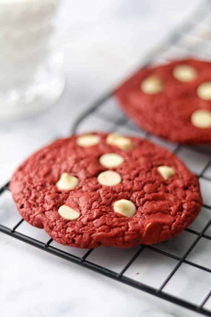 The perfect red velvet cookies using cake mix recipe for a perfect love day. With simple ingredients and easy steps you can enjoy a beautiful red cookies topped with chocolate chips.