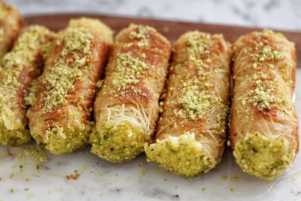 mouthwatering crunchy Kunafa rolls, it is filled with ashta cream wrapped inside golden, crunchy strands of sticky sweet kunafa.