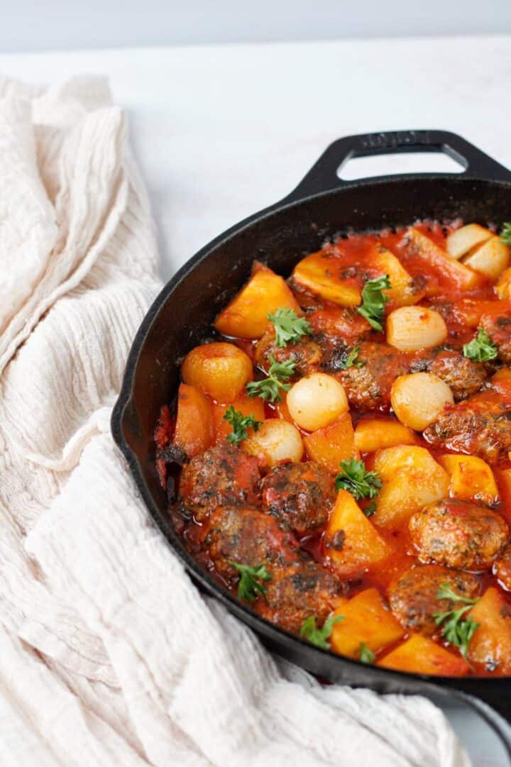 Dawood Basha is a Middle Eastern meatball stew simmered in a flavorful tomato sauce with cubes of tender potatoes.