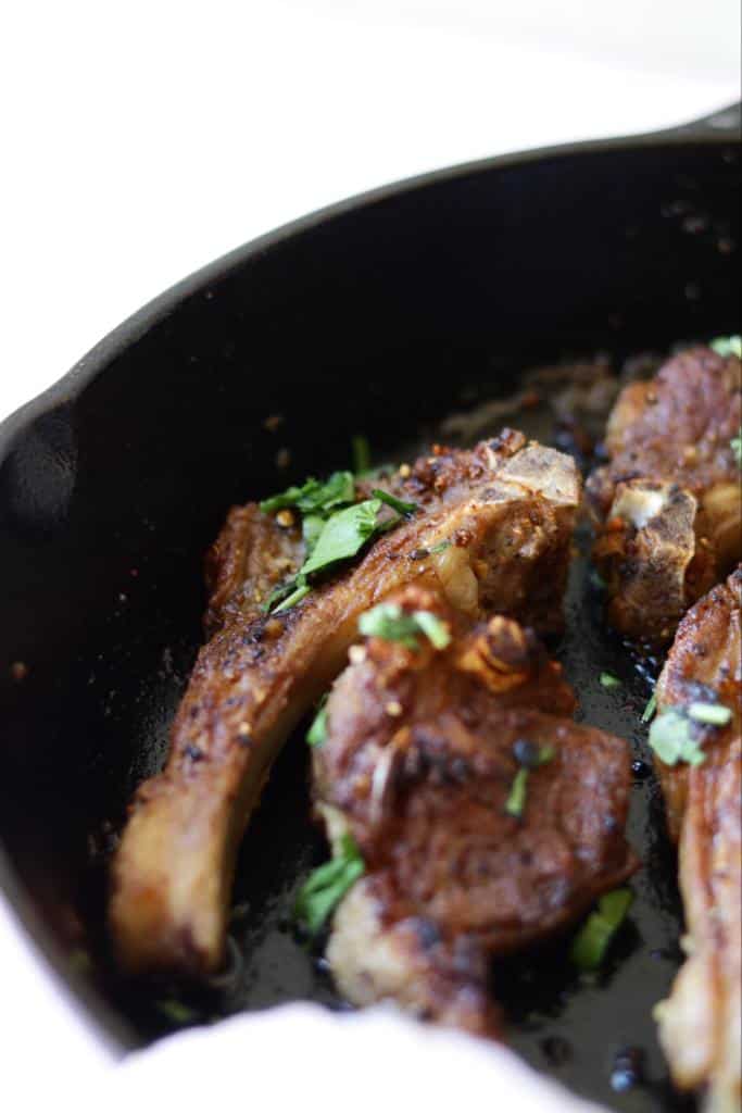 These baby lamp chops are marinated in garlic and seasoned with Montreal seasoning. They are tender and juicy.