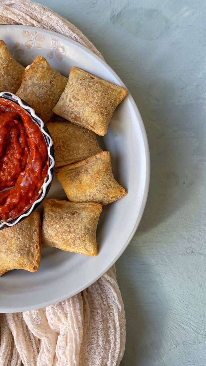delectable totino's frozen pizza rolls cooked in the air fryer served with super delicious Marinara sauce
