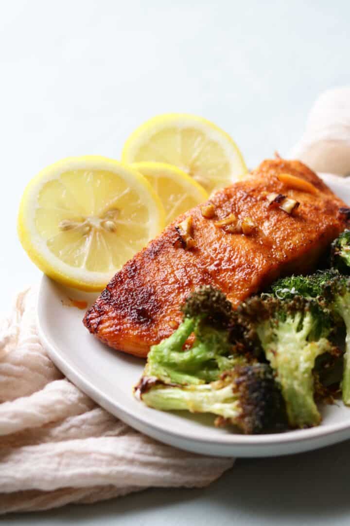 Honey glazed air fried salmon fillets with air fried vegetables like broccoli for a healthy and quick meal. This recipe includes a special sweet sauce for your salmon.