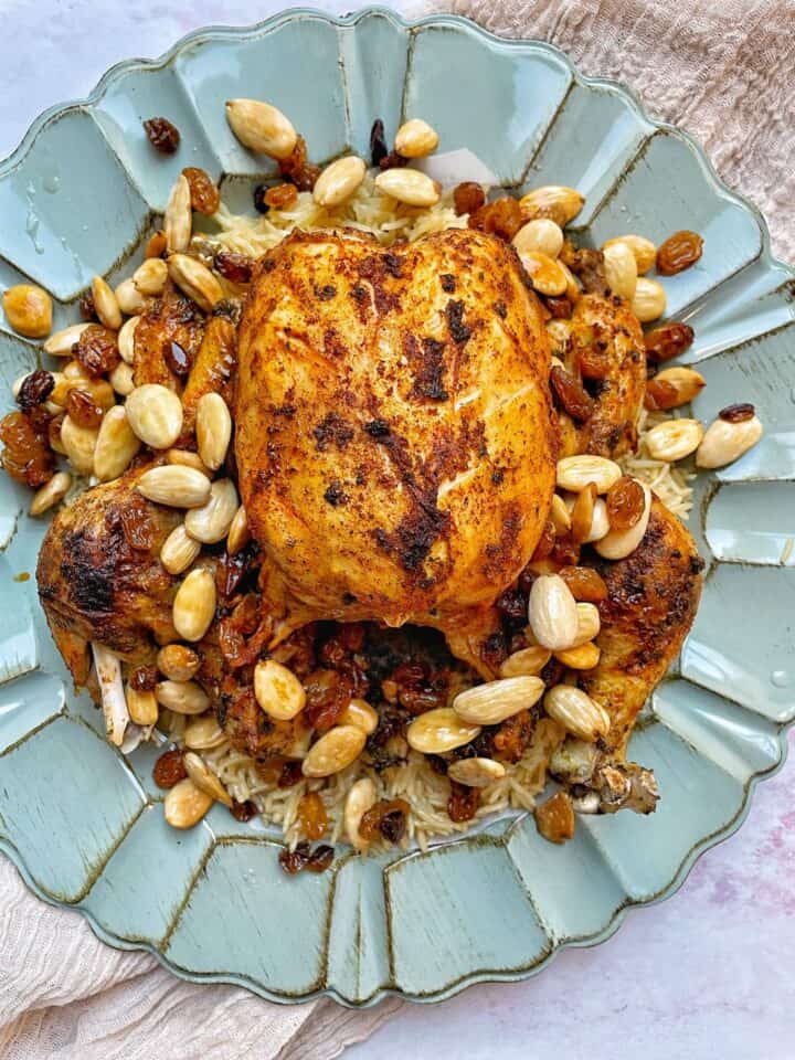 This instant pot whole chicken and rice recipe is cooked all in the same pot! Cooking the chicken to golden perfection, then using the pan juices to cook some fluffy rice.
