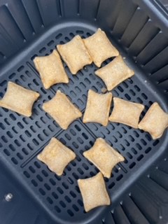 place frozen pizza rolls in an even layer in the air fryer basket