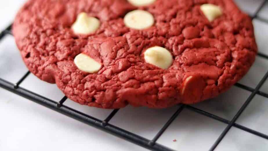 With simple ingredients and easy steps you can enjoy a beautiful red cookies topped with chocolate chips. It is a quick and easy cookies recipe.