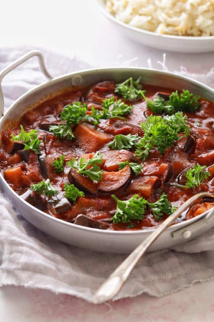 This warm hearty stew makes the perfect comfort meal! It's made with eggplants and onions simmered in tomato sauce. It's a hearty meal packed with flavor.