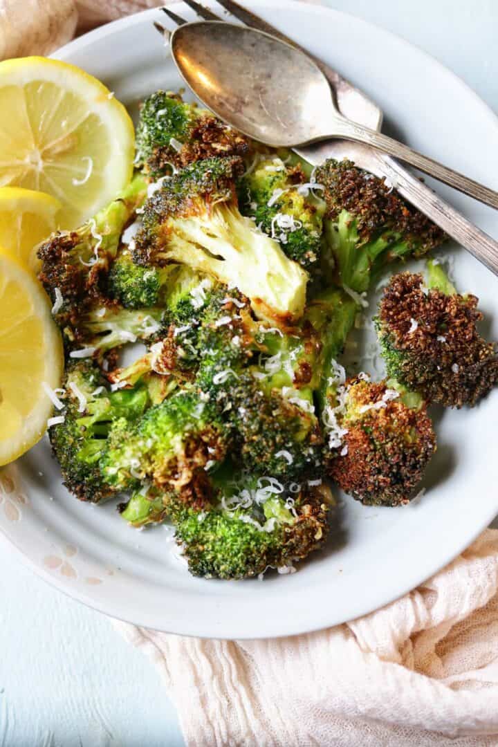 crispy air fryer broccoli parmesan sprinkled with extra parmesan cheese before serving and lemon cutlets