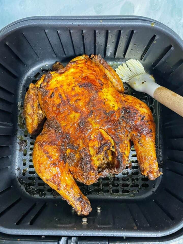 crispy cosori whole roasted chicken with a tender juicy inside and amazing outside flavor due to the combination of spices on the crispy skin