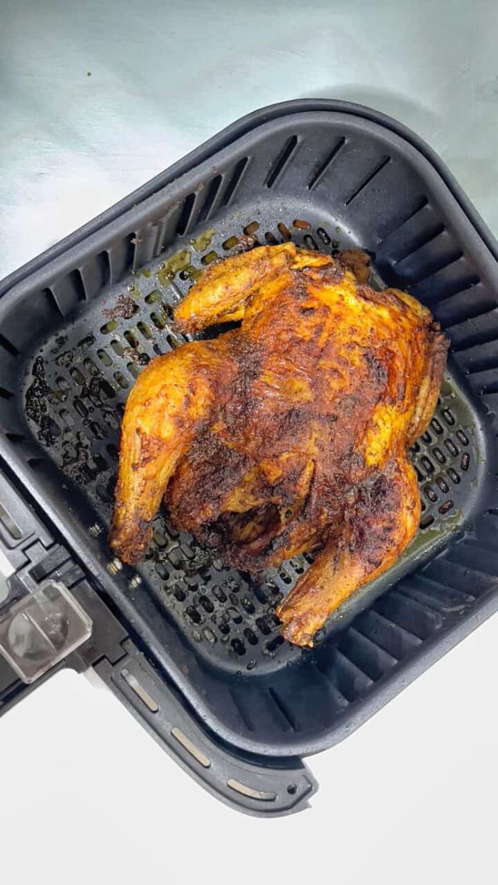 golden rotisserie chicken ready to be served. Delicious crispy skin on the outside and  juicy tender inside