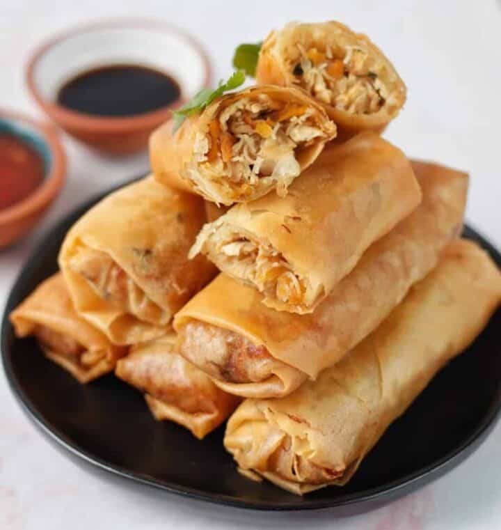 This Rice Noodle Egg Rolls recipe introduces a delicious filling of vegetables, protein, sauce, and vermicelli noodles wrapped in a golden crispy layer.