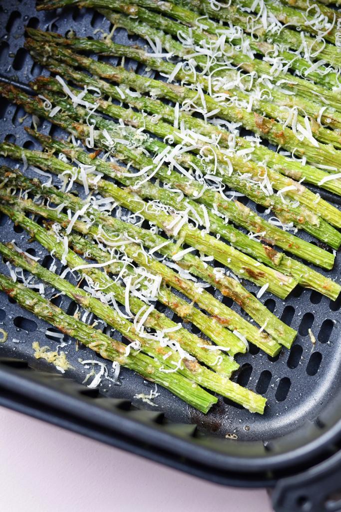 The asparagus roasted in the air fryer are so delicious. They are seasoned with garlic and onion powder, and olive oil. They are topped with parmesan that adds an irresistible taste to the asparagus.