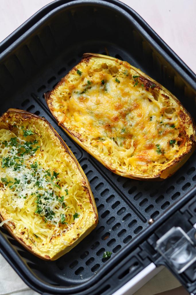 Creamy, cheesy, and savory spaghetti squash with alfredo sauce and cheese in the air fryer. It makes the perfect low carb dinner.