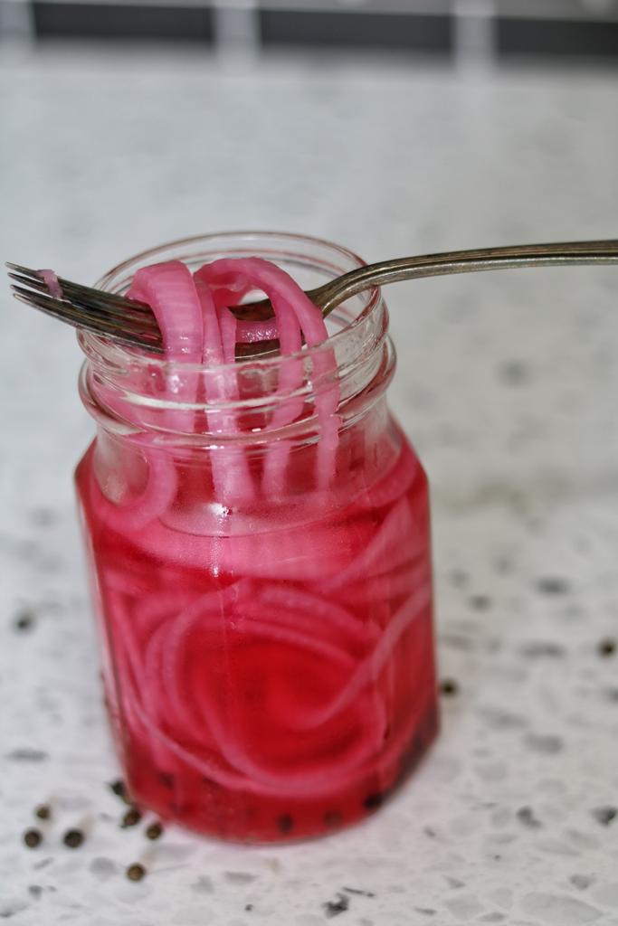 A jar of bright pink onion pickles is one of the main condiments to keep in your kitchen. Add it to your sandwiches and salads. Enjoy!
