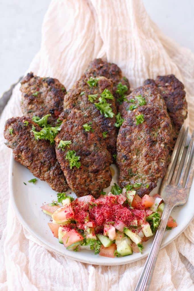 Ground Beef Kafta Kabobs made up with ground beef and spices, and served with lebanese fattoush salad