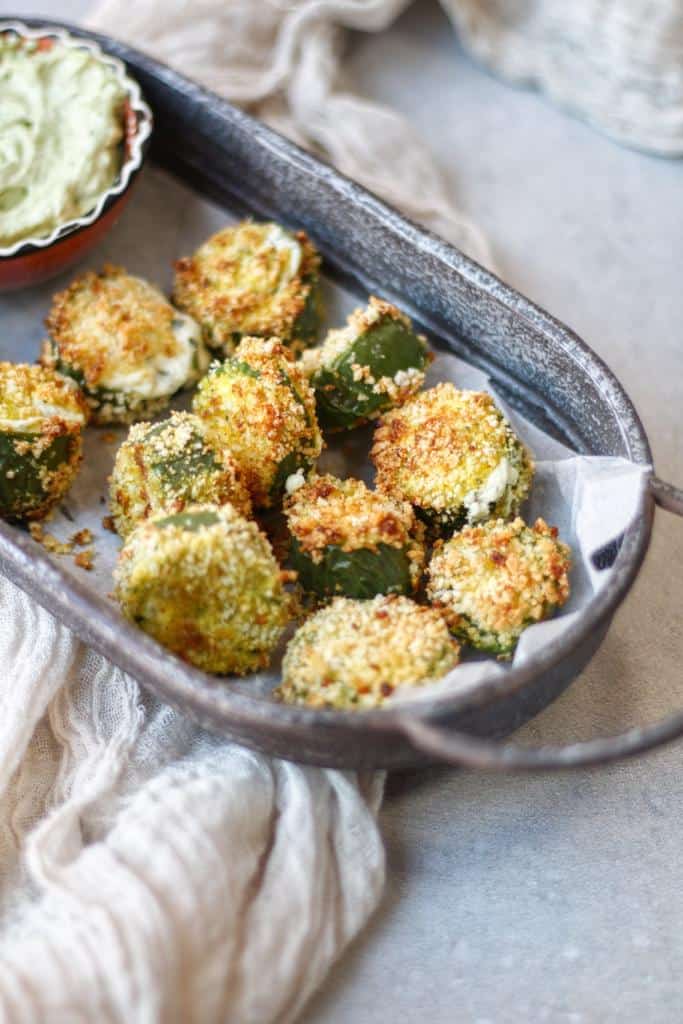 Fresh Jalapenos are filled with a rich creamy cheese filling and topped with a crisp Panko topping. These poppers are air-fried until golden and bubbly for the perfect game day snack!