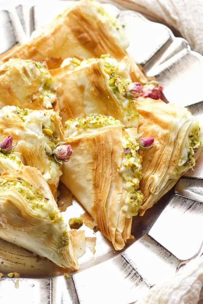 Shaabiyat are layers of buttery flakey phyllo dough, stuffed with ashta, and drizzled with attar syrup