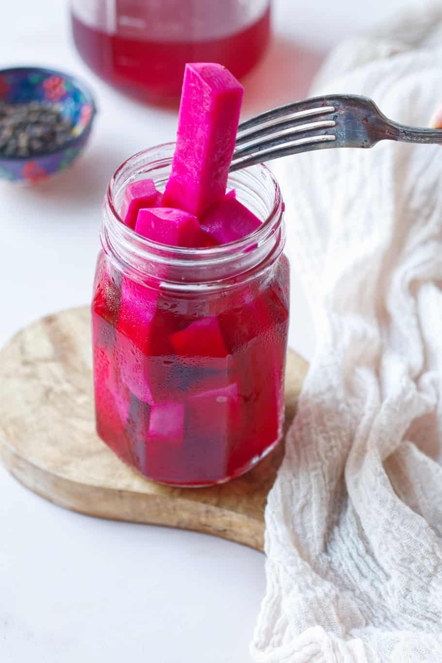 a refrigerator pickled turnips having wonderful pink color and perfectly crunchy texture