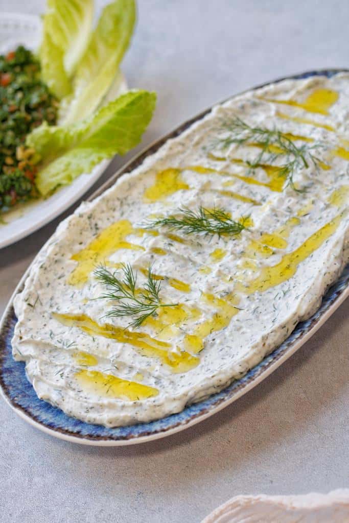Yogurt dip  drizzled with olive oil and ready to be served alongside grilled meats and vegetables.