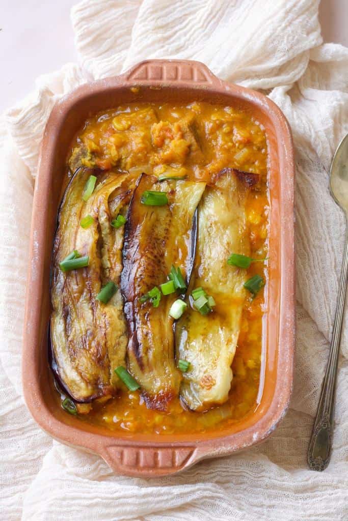 Khoresh Gheymeh Bademjan is a hearty stew made with aubergine, yellow split peas, tomatoes, onions, and meat