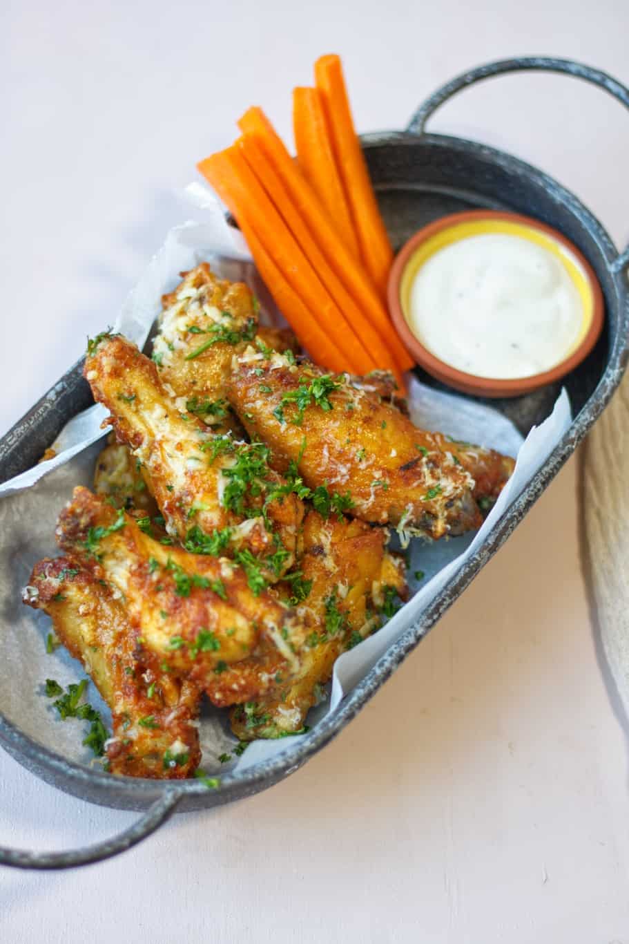 sprinkle your garlic parmesan wings made in the air fryer with finely chopped fresh parsley and serve them alongside roasted carrots and garlic Parmesan sauce