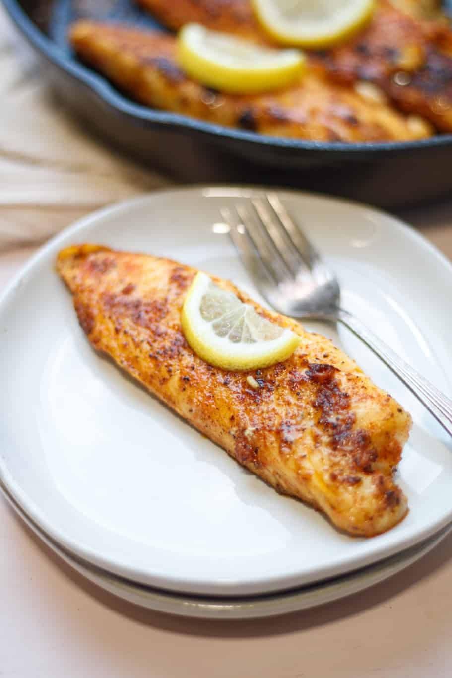 tender and juicy tilapia fillet served in a white dish