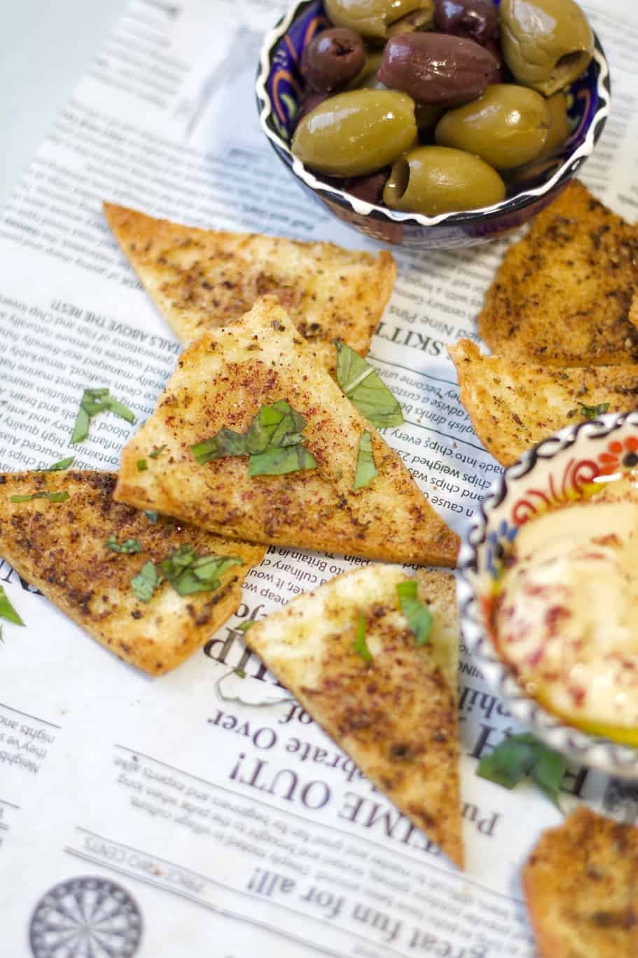 simple golden crispy pita chips recipe with olives