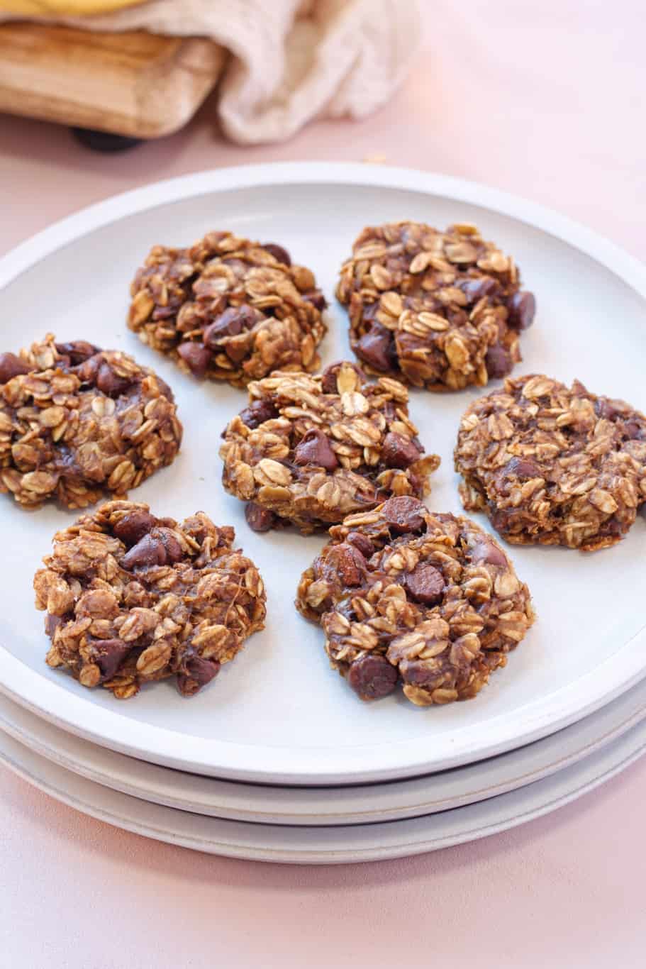 7 pieces of healthy oatmeal cookies on a white serving dish served as breakfast or afternoon snack.