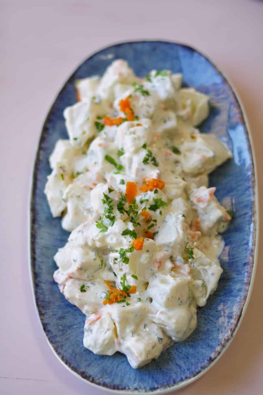 juan pollo potato salad recipe made up of potatoes, carrots, mayonnaise, and heavy cream 