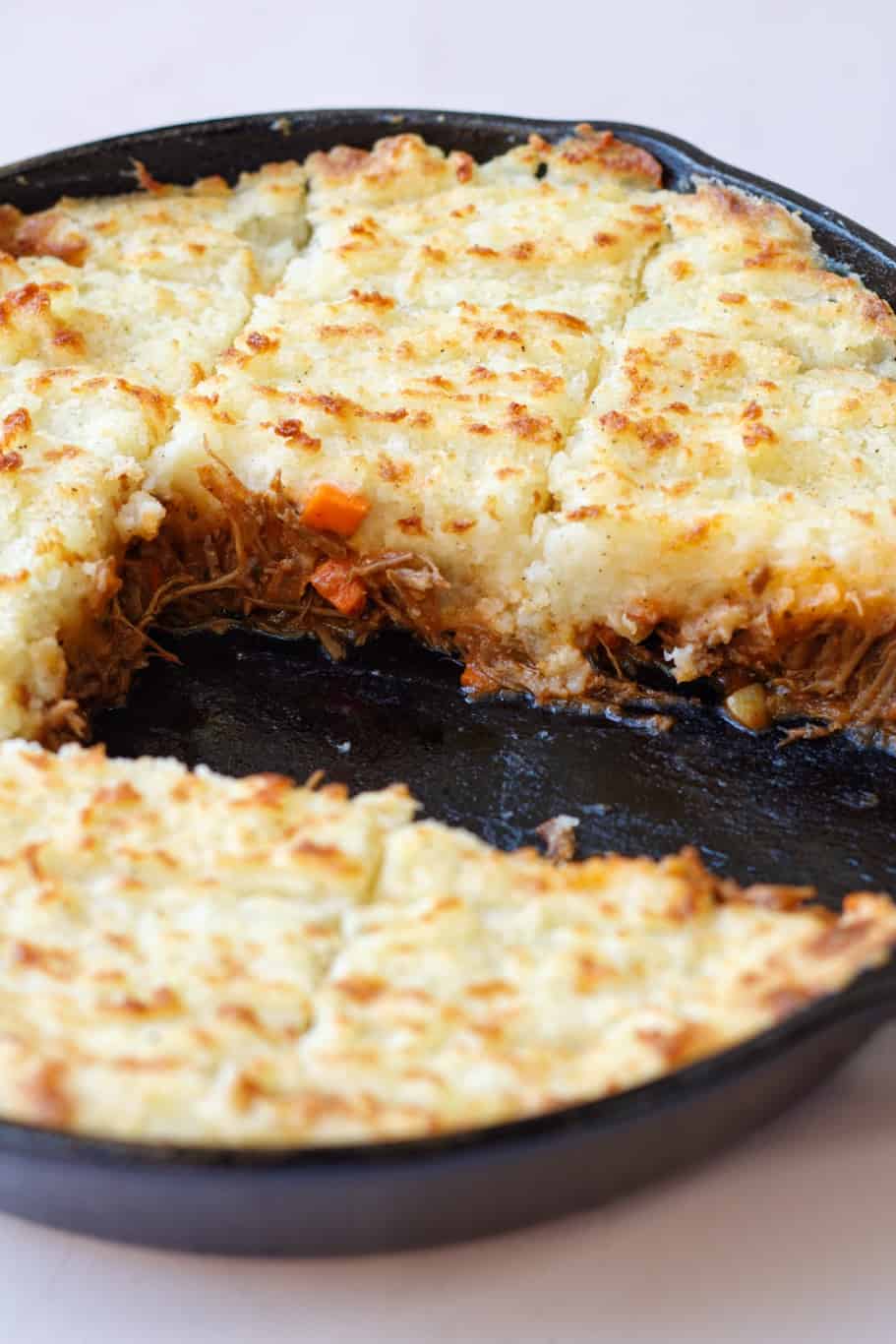 Shepherd's pie made with saucy, deeply flavorful filling, a creamy potato topping, and an awesome golden cheese crust