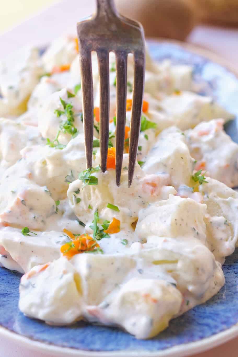 juan pollo potato salad rich with creamy mayo dressing served with finely chopped fresh parsley and finely chopped carrots