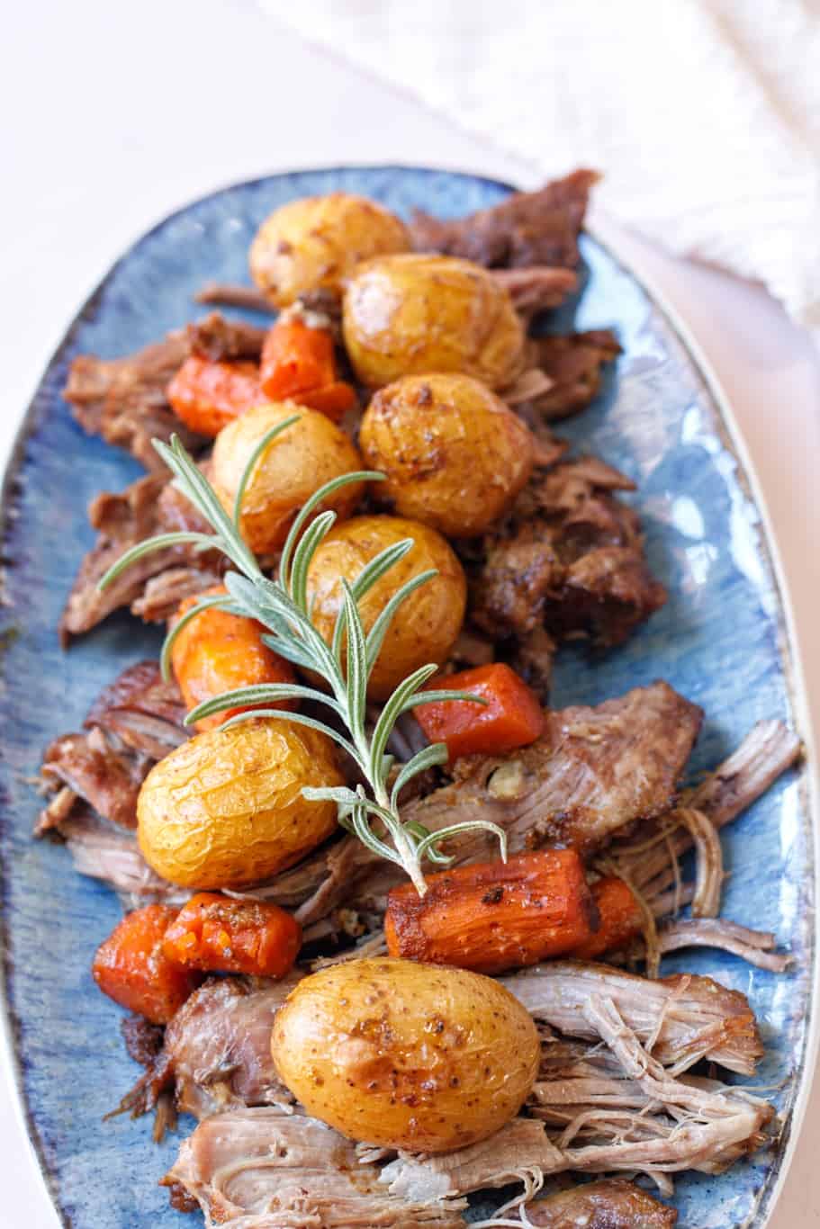 tender and juicy lamb shanks with roasted carrots and golden potatoes