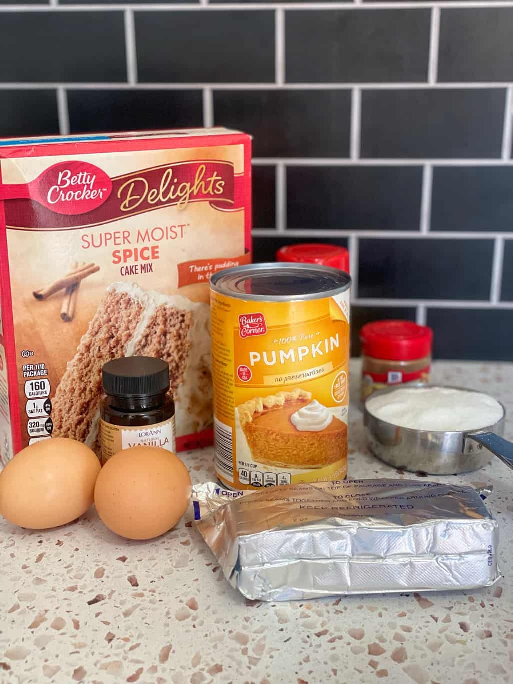 This pumpkin muffin recipe needs the following ingredients: canned pumpkin puree, eggs, spice cake mix box, pumpkin pie spice, Cinnamon, cream cheese, granulated sugar, and vanilla extract