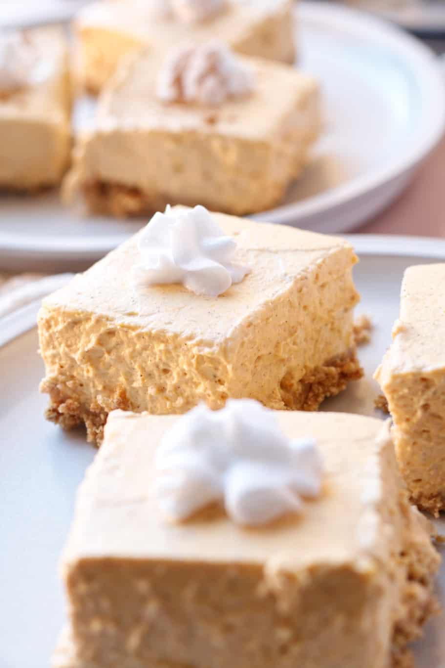 Make delicious mini bars with a graham cracker crust and pumpkin cheesecake filling.