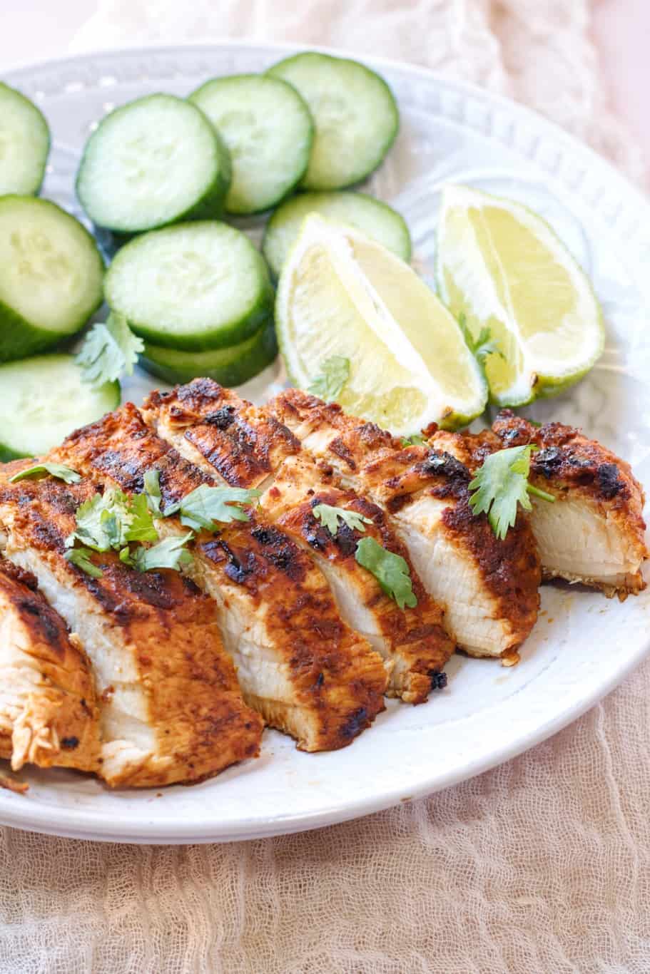 juicy chicken bursting with flavor from the chipotle marinade served with cucumber slices and lemon wedges