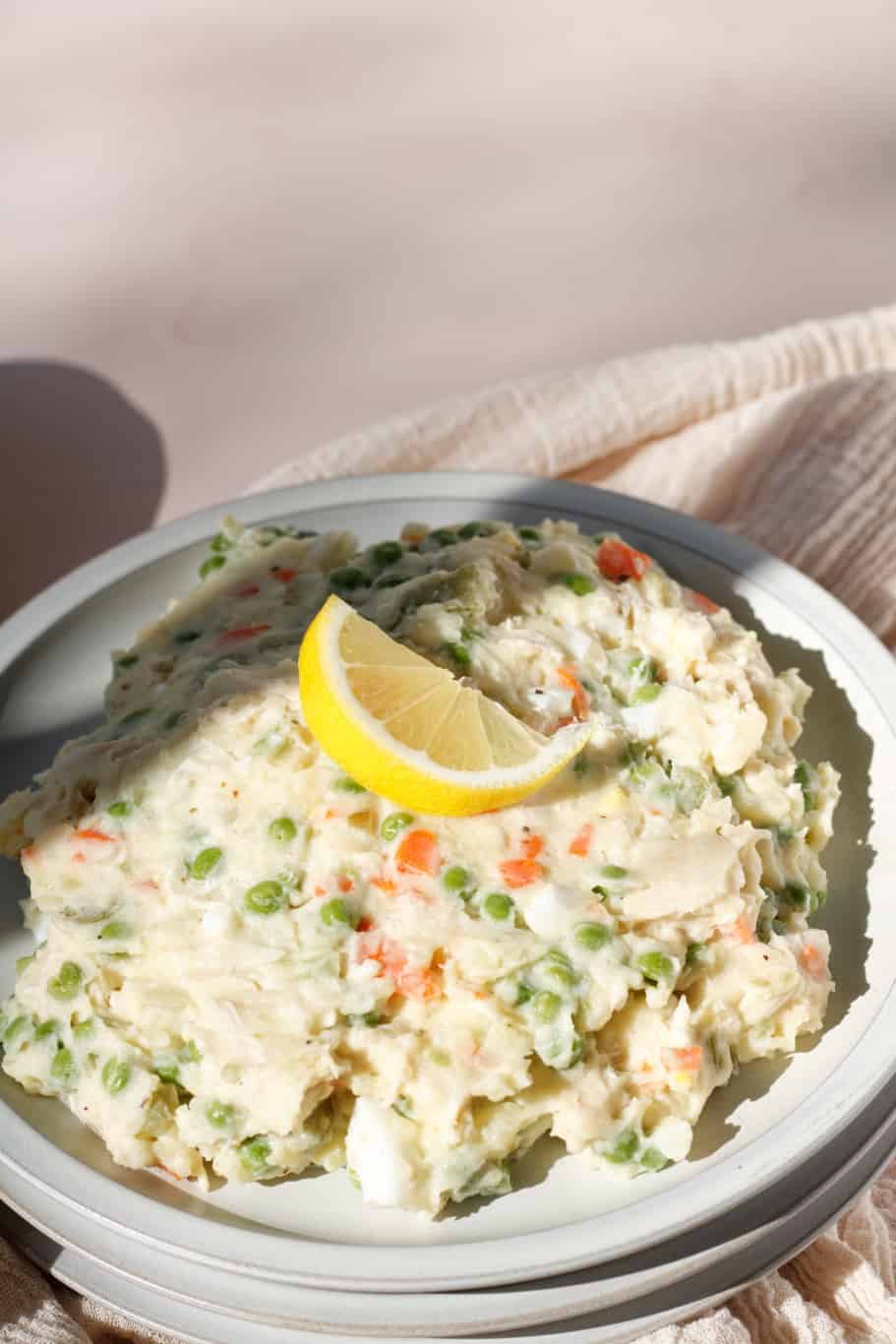 refreshing creamy Persian chicken salad served as a side dish with lemon wedges on the top.