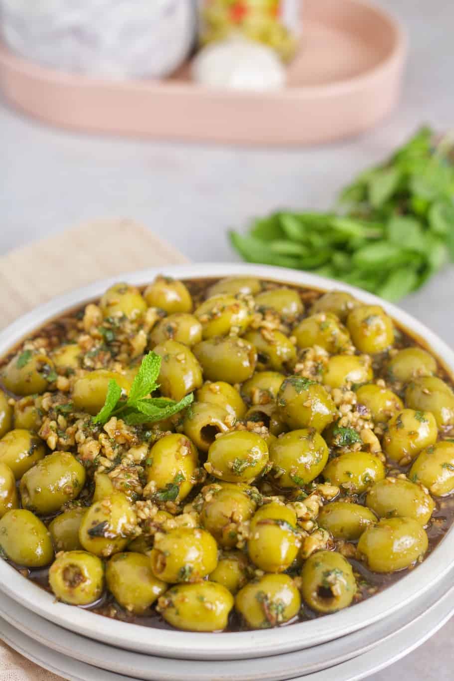 a bowl of Persian marinated olives appetizer that is wonderfully prepared with pitted olives and chopped walnuts