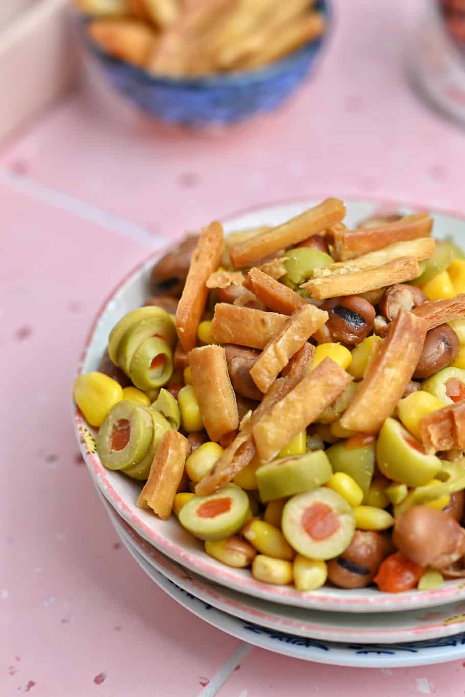 Mediterranean fava bean salad with chopped olives and corn marinated in a tangy dressing
