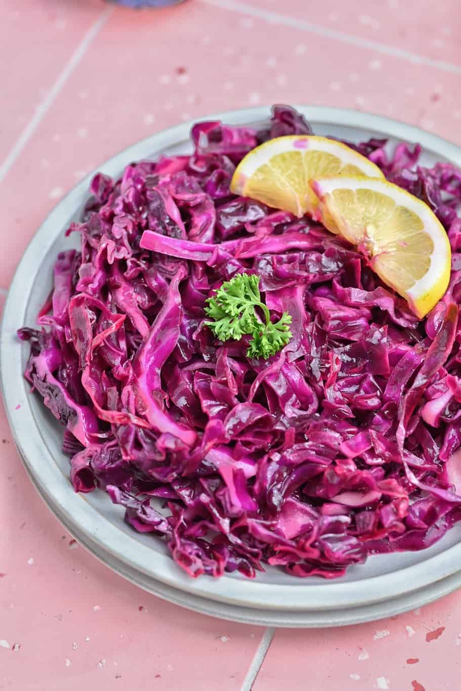 a bowl of red cabbage salad with lemon juice and oil dressing