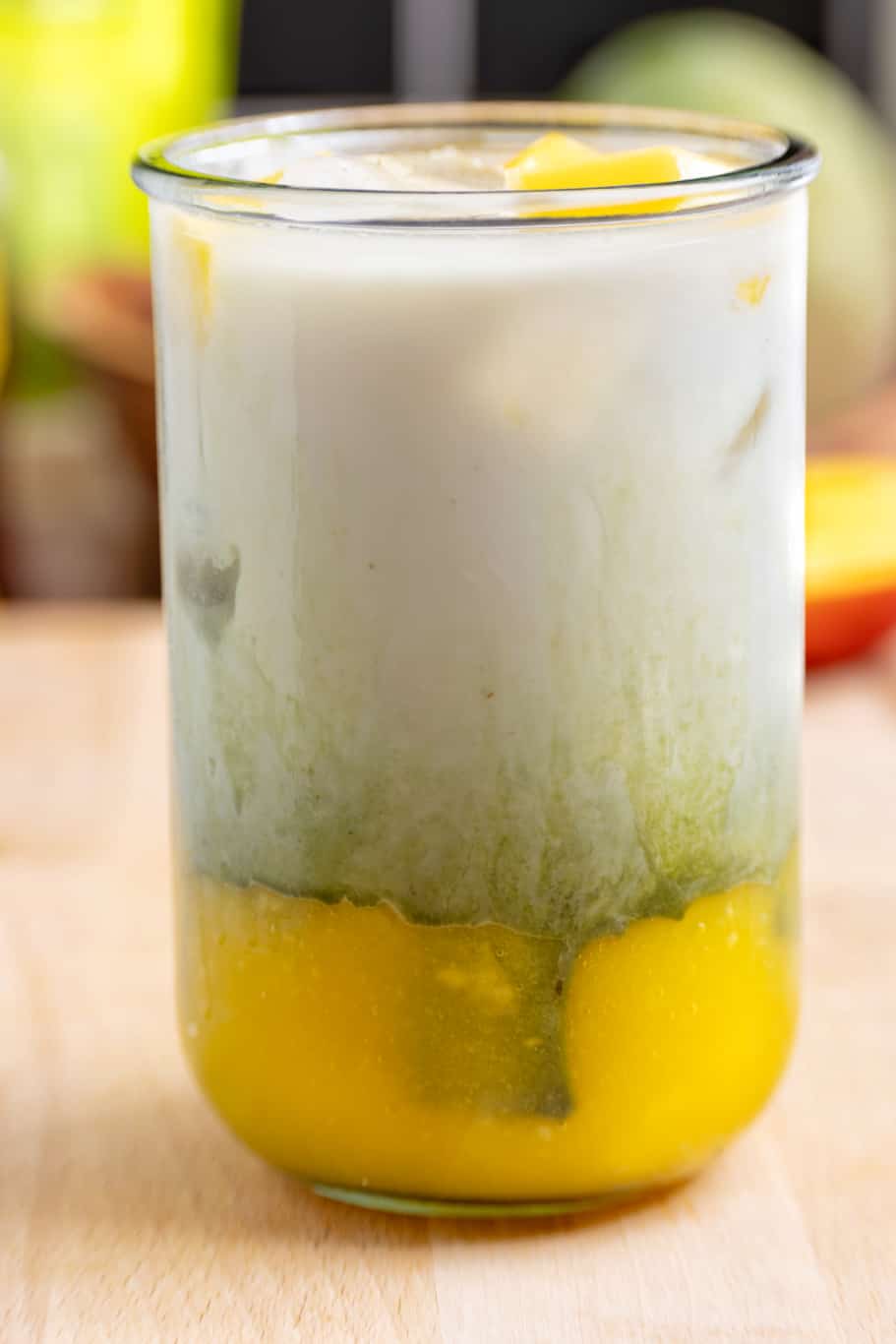 iced matcha latte mango is a refreshing delicious of two beautiful yellow and green layers